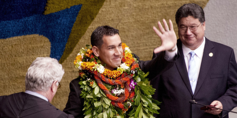 State Sen. Kai Kahele, center, waves at the Hawaii State Capitol in Honolulu on Feb. 17, 2016. Kahele was elected to the U.S. House to represent Hawaii's 2nd congressional district.