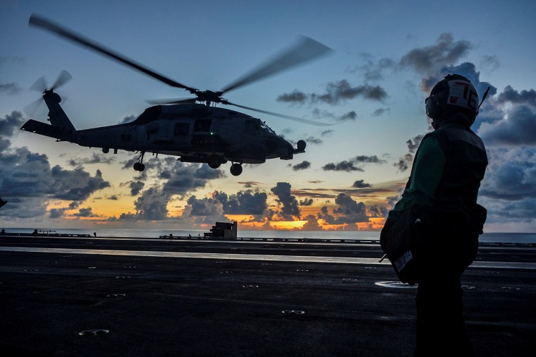 Image: A helicopter aboard the U.S. Navy aircraft carrier USS Ronald Reagan in the South China Sea in July. 