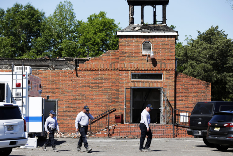 Alcohol Tobacco and Firearms Bureau investigators work the crime scene of the burnt ruins of the Mount Pleasant Baptist Church, one of three that burned down, in Opelousas, La., on April 10, 2019.