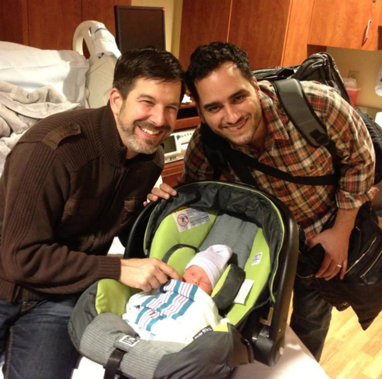 Jose Rolon and his late husband, Tim Merrell, with their son, Avery.