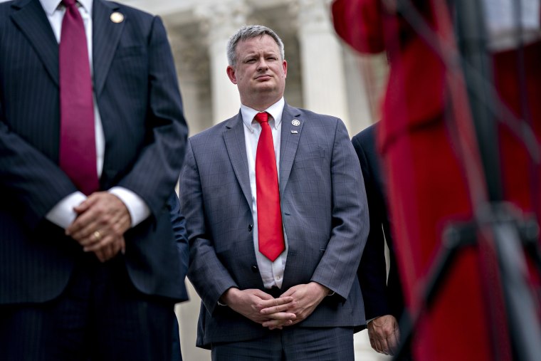 Image: Jason Ravnsborg, South Dakota attorney general, listens during a news conference outside the Supreme Court in Washington.