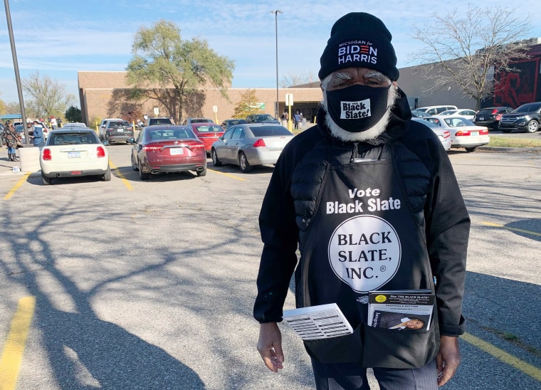 The Rev. Gary Bennett, 81, urges voters to support Joe Biden and other candidates endorsed by the Black Slate, a local political organization, in Detroit on Tuesday.