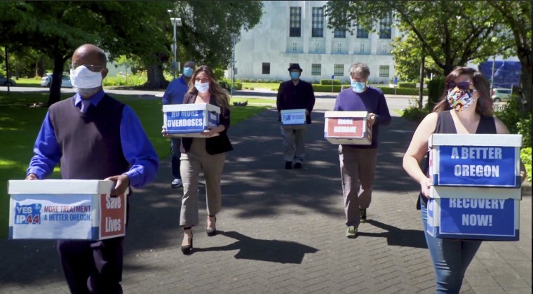 Volunteers deliver signed petitions in favor of Measure 110 in Salem, Ore., on June 26, 2020.