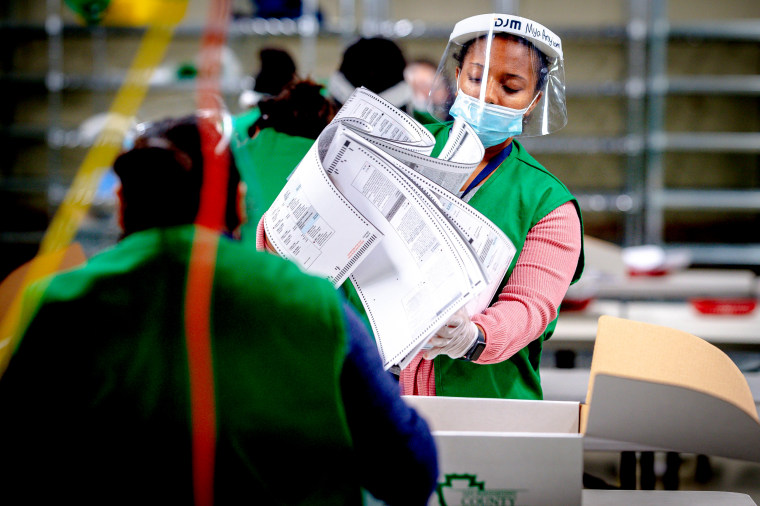 Image: Election workers process ballots in San Bernardino, Calif., on Election Day.