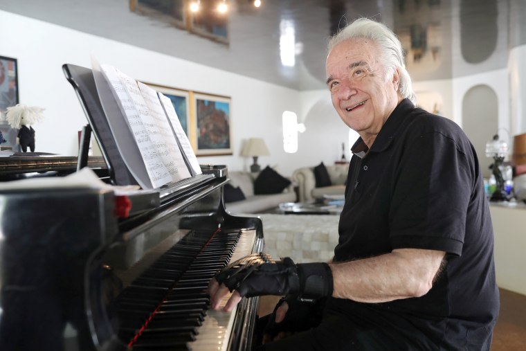 Image: Brazilian conductor and pianist Joao Carlos Martins plays piano at his house in Sao Paulo