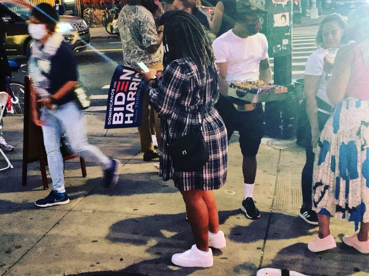 Image: People celebrate in Harlem