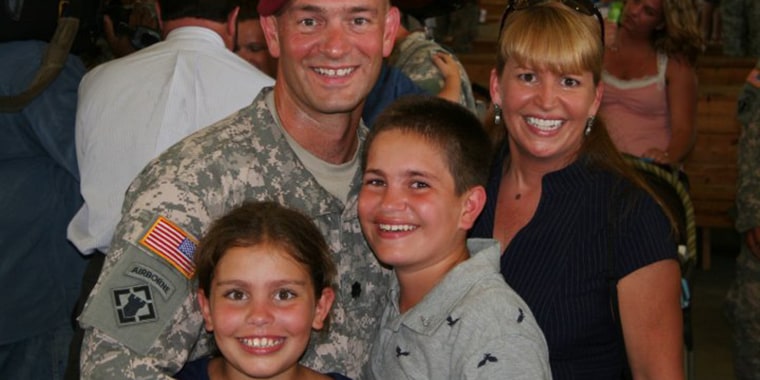 Lt. Col. Paul Huszar reunites with his family after returning from his deployment to Iraq.