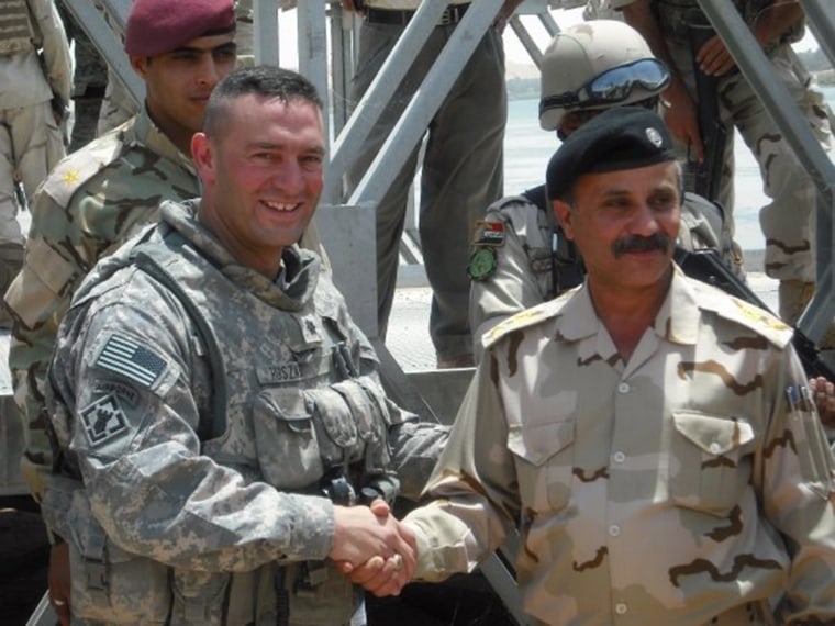 Lt. Col. Paul Huszar, an engineer, greets the Iraqi Army Chief of Engineers.