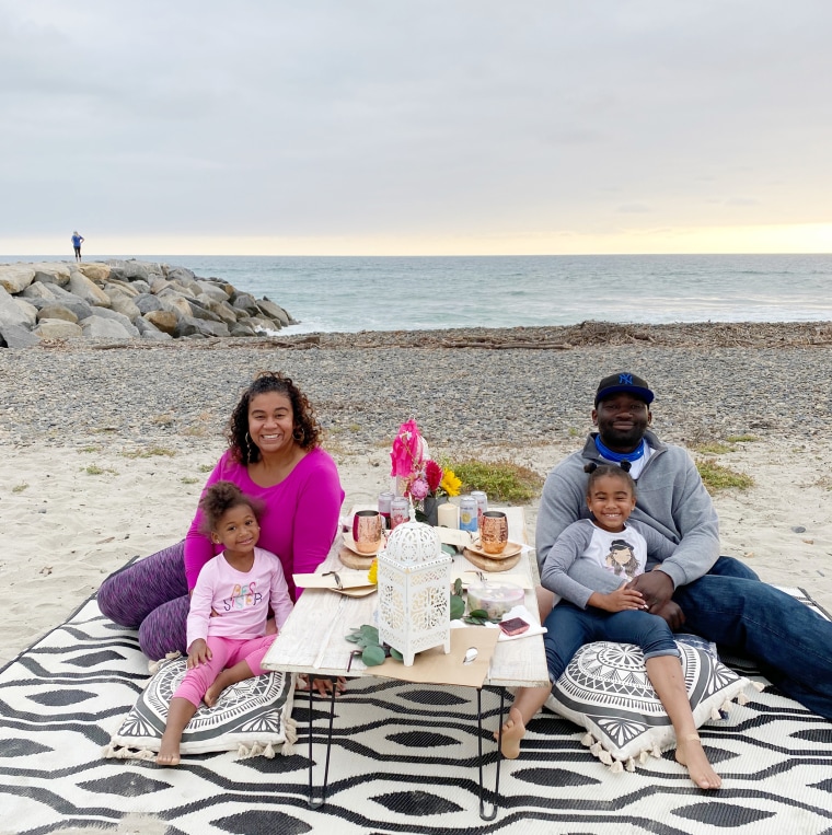 A family enjoys a curated picnic in San Diego