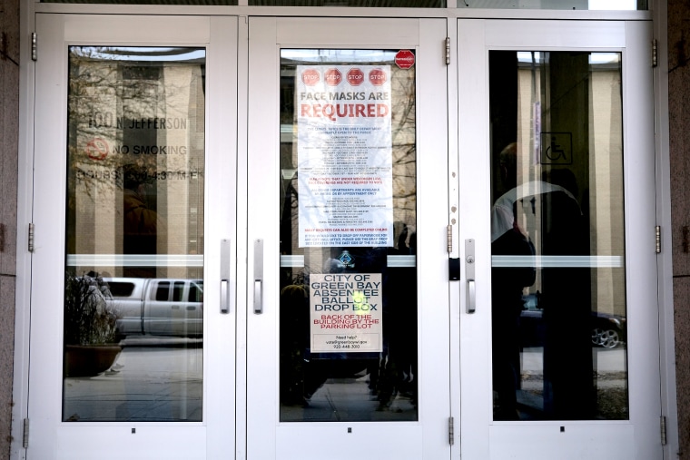 Image: In-person early voting begins in Wisconsin, two other states