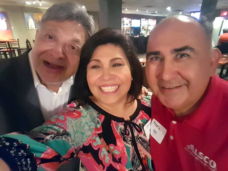 Dr. Fitz, left, with his friend of more than 15 years, Christy Martinez-Garcia, and her husband, Frank Garcia.