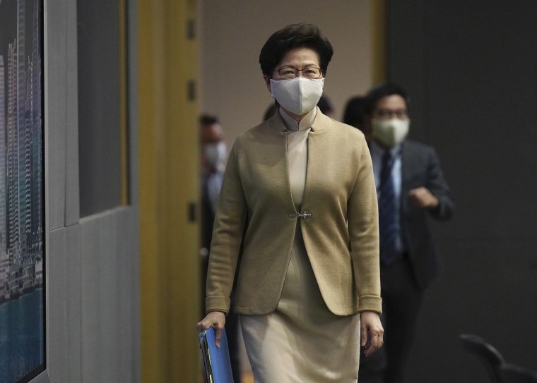 Image: Hong Kong Chief Executive Carrie Lam arrives at a press conference in Hong Kong,