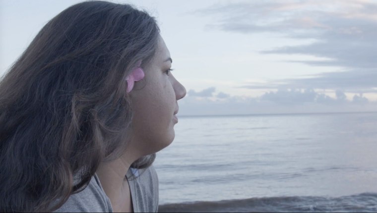 Caregiver Kamaile Kapanui takes a moment to reflect on the beach in Waimea, Hi.