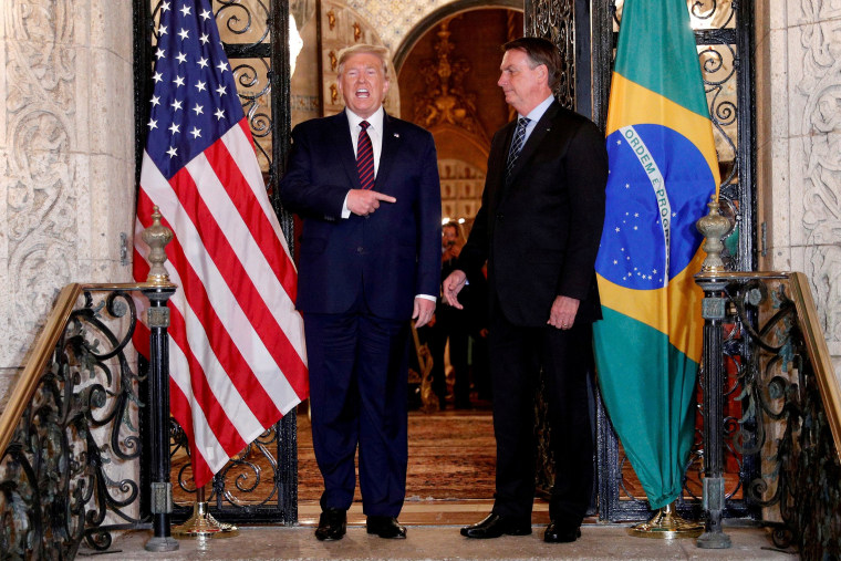 Image: President Donald Trump hosts a photo-op with Brazilian President Jair Bolsonaro before attending a working dinner at the Mar-a-Lago resort in Palm Beach, Fla