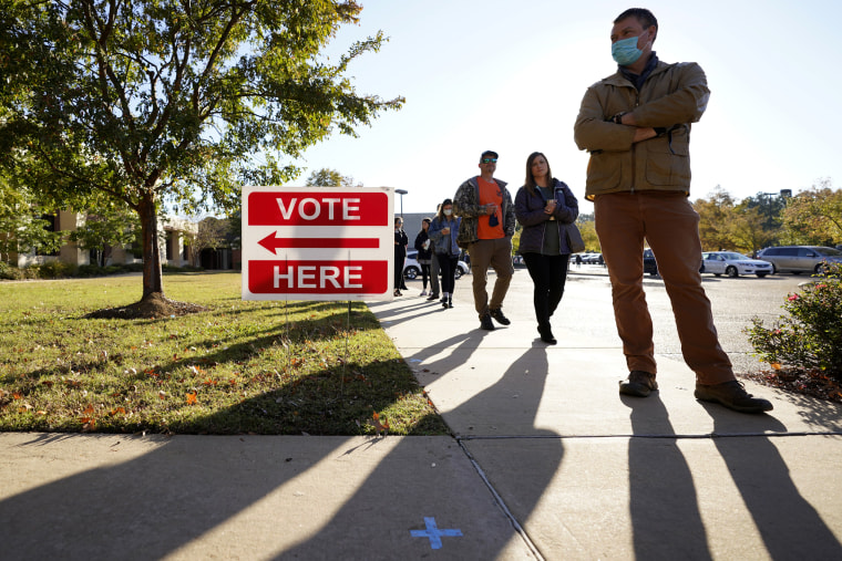 Image: Voters stand in line to cast ballots in Ridgeland, Miss., on Election Day.