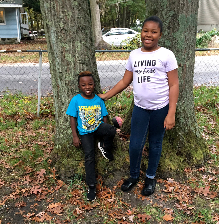 Amiracle, a sixth-grade student in Longwood, on New York's Long Island, with her brother Khalif.