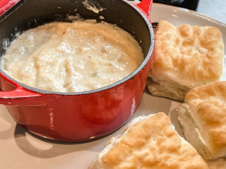 Aleman recommends serving the gravy in a stoneware crock to keep it warm and keep it from making other items on the plate soggy.