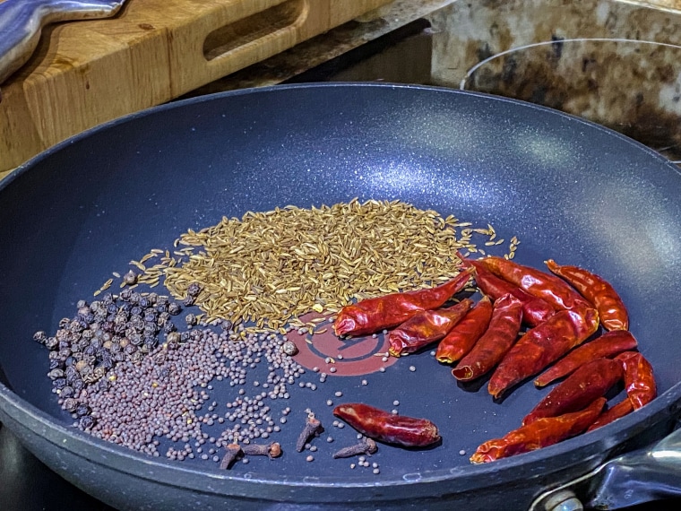 The recipe, which Sharma shared on Reddit, starts with dry-roasting spices in a pan on the stove.