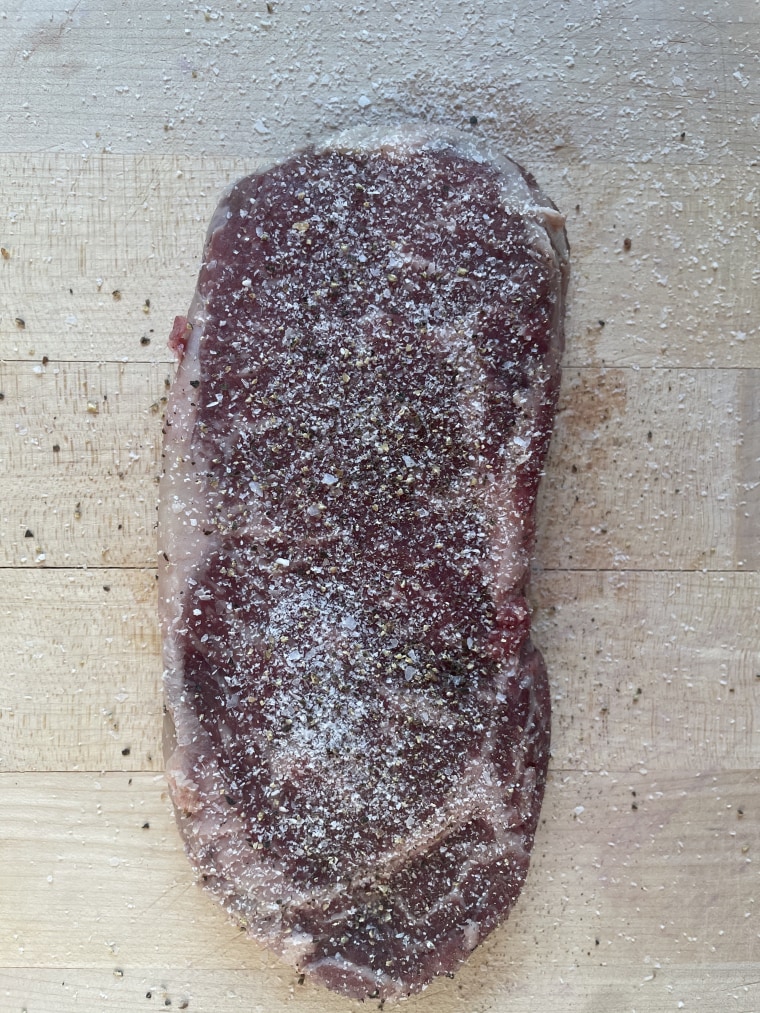 Press salt and pepper gently into the surface of the meat after apply to ensure it adheres.