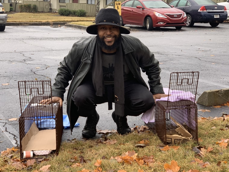 Sterling TrapKing Davis smiles with humane traps for cats.