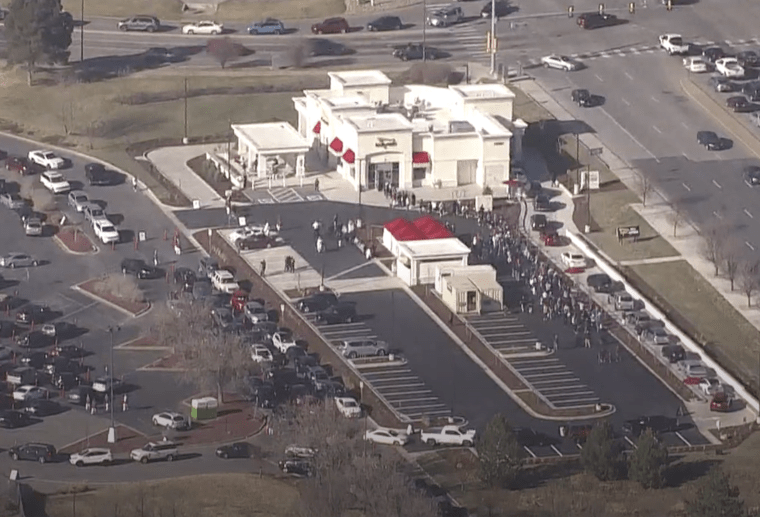 Hundreds of people wait in line at one of the first In-N-Out locations in Colorado.