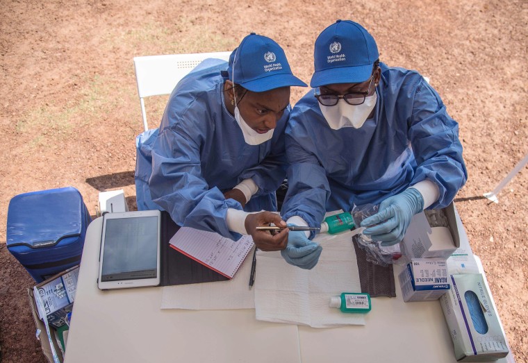 Image: Nurses working with the World Health Organization (WHO) prepare to administer Ebola vaccines