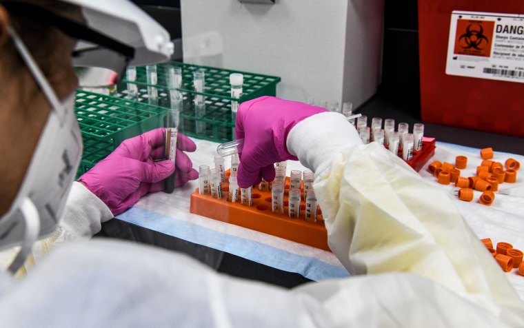 A lab technician sorts blood samples inside a lab for a Covid-19 vaccine study at the Research Centers of America (RCA) in Hollywood, Florida.