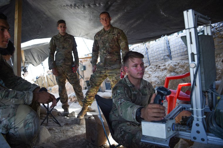 Image: U.S. Army soldiers serving with NATO at a checkpoint during a patrol against Islamic State militants in the eastern province of Nangarhar Province, Afghanistan.