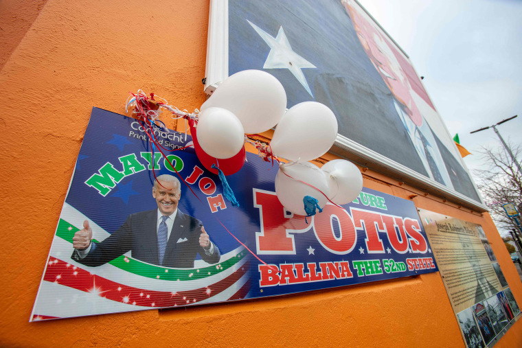 Image: A poster shows support to U.S. president-elect Joe Biden in his ancestral hometown of Ballina in County Mayo in northwest Ireland