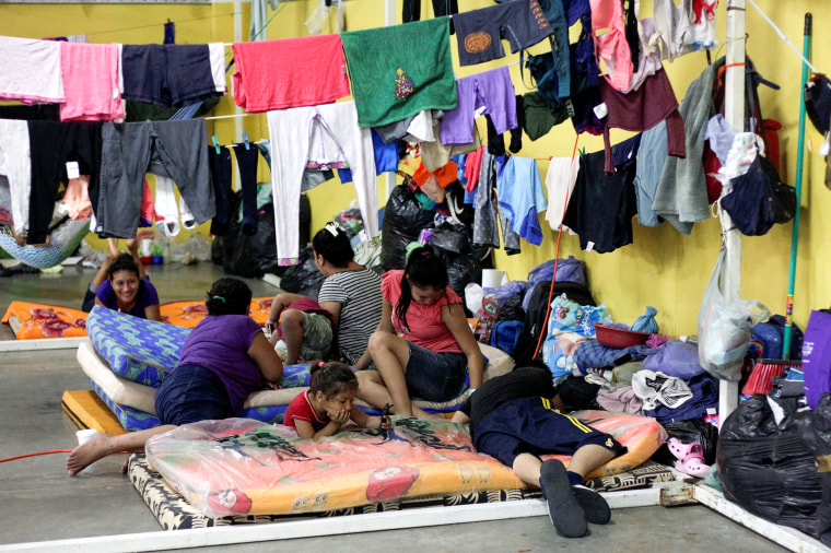 Image: Residents rest at a shelter for people affected by the floods caused by heavy rain brought by Storm Iota, in San Pedro Sula