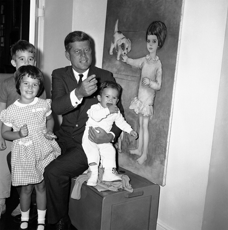 Maria Shriver at age 4 in 1960 with her uncle John F. Kennedy, who's holding his nephew Timothy Shriver, 14 months. Also pictured is Bobby Shriver, age 6.