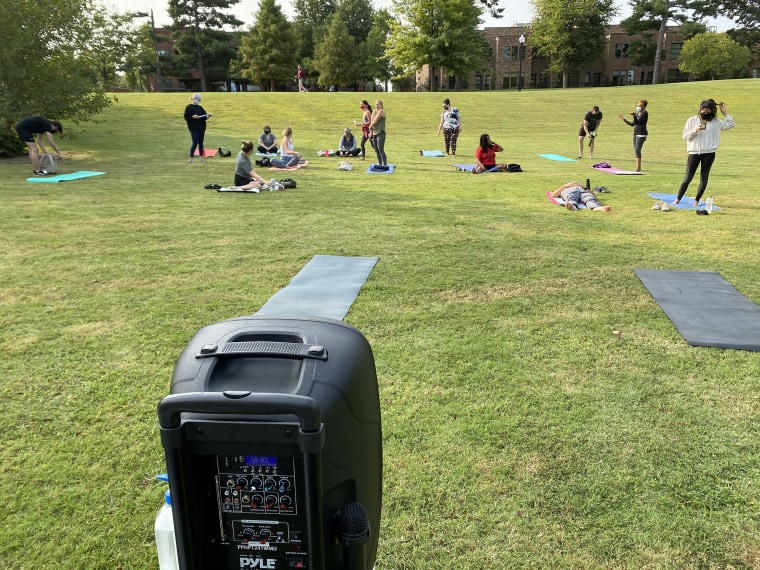 Saunders teaches socially distant, donation-based yoga classes in local parks. The couple said it's been a great way to connect with their new community.
