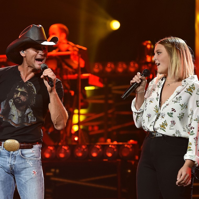 Tim McGraw performing with daughter Gracie in 2015