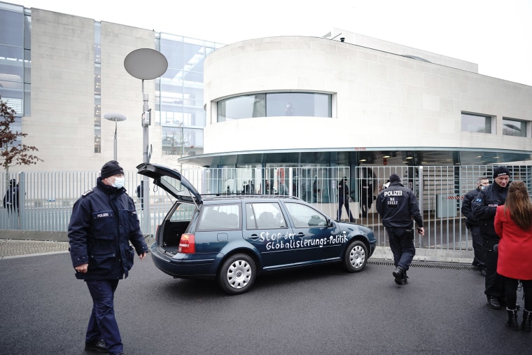 Image: A green Volkswagen crashed into the gate of the building housing German Chancellor Angela Merkel's offices in Berlin on Wednesday.