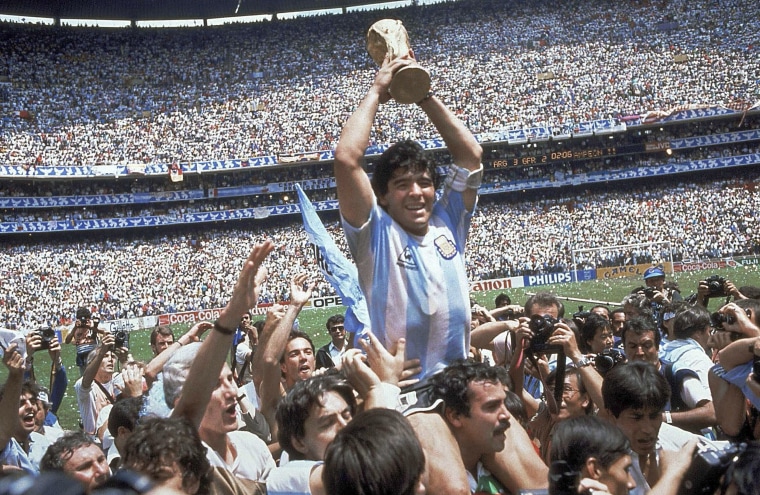 Image: Diego Maradona holds up the 1986 World Cup trophy