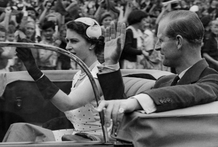 Queen Elizabeth II and Prince Philip return from a youth rally in Auckland, New Zealand, during the coronation world tour on Dec. 24, 1953.