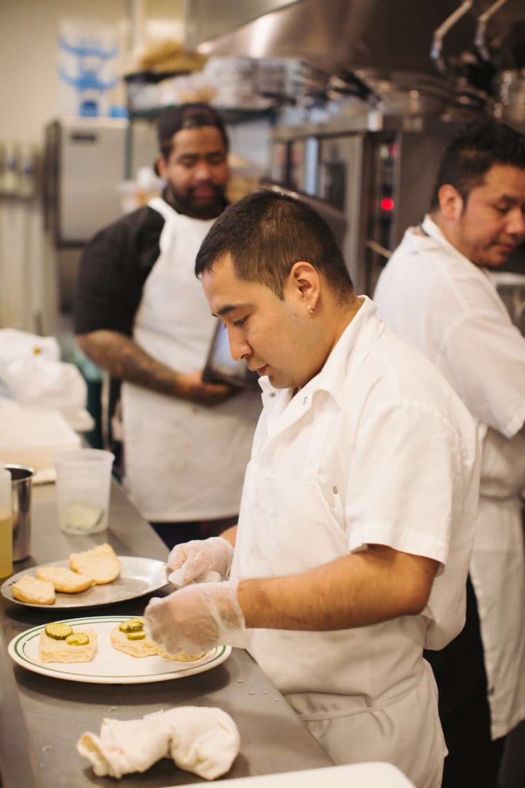 Line cooks prepare both in-person and virtual orders for Fine-Drawn Hospitality's The Post and The Commons. 