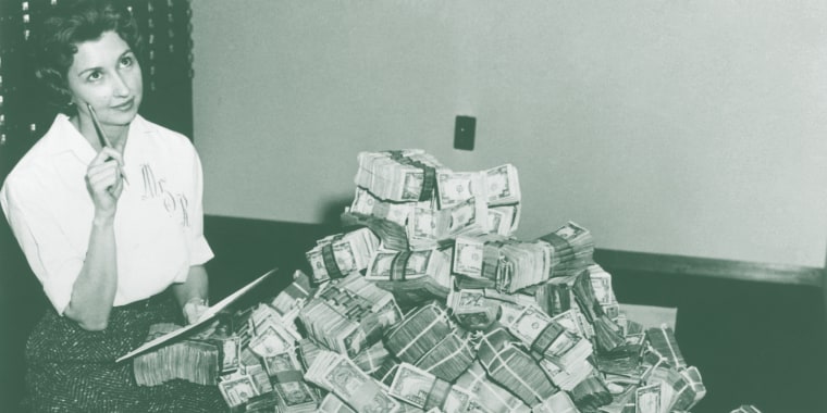 Bank Employee Sitting by a Million Dollars in Cash
