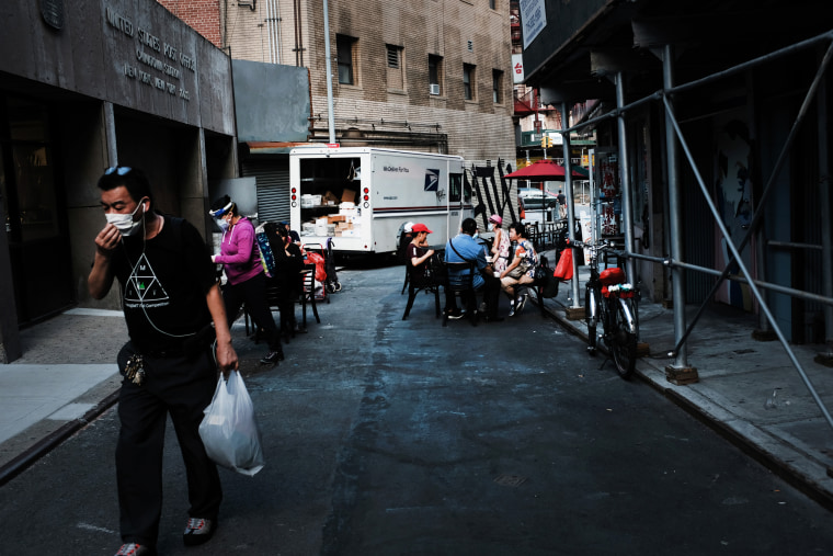 Image: People dine outside in New York's Chinatown on Aug. 10, 2020.