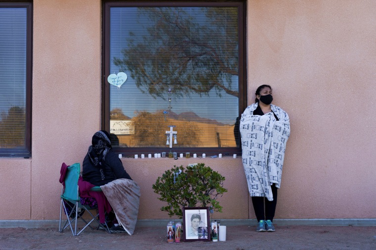 Image: Family of Jose Garcia, 67, who is currently being treated for COVID-19 on a ventilator, wait by his hospital window during a surge of coronavirus disease (COVID-19) cases at Memorial Medical Center in Las Cruces