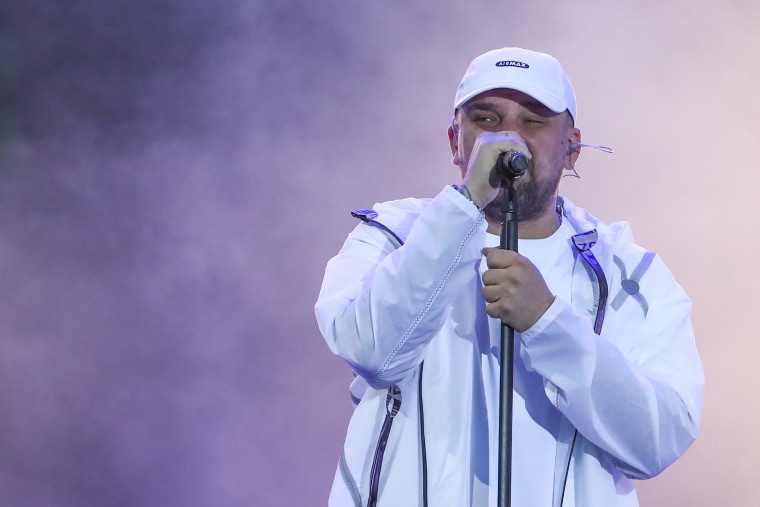 Image: Russian rapper Basta (Vasily Vakulenko) performs during a drive-in concert as part of the Live &amp; Drive series at a parking lot of Luzhniki Sports Complex, Moscow.