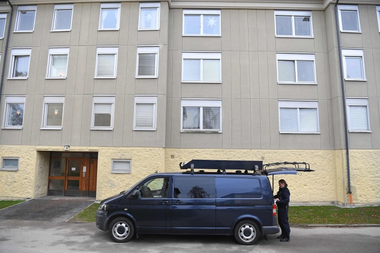 Image: A police technician prepares for the examination of an apartment house in Haninge, south of Stockholm, on Dec. 1, 2020, after a man was discovered after being imprisoned by his mother.