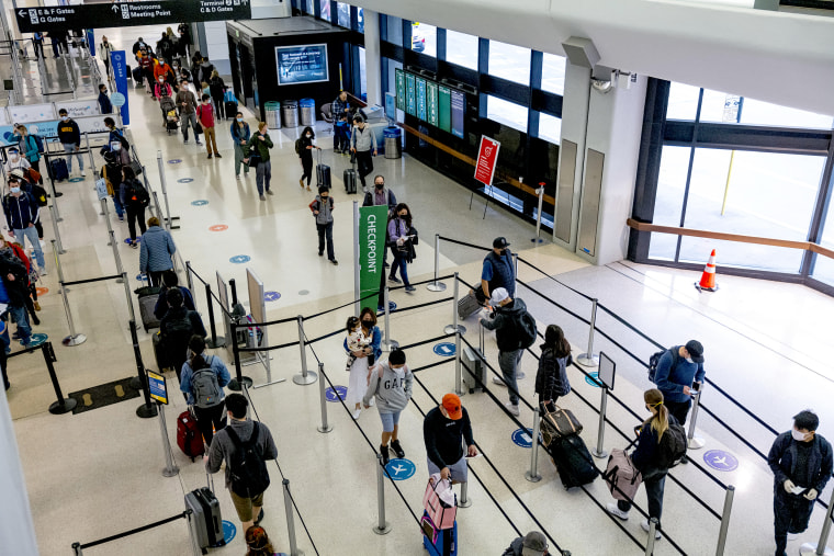 Travelers At SFO Airport As U.S. Holiday Air Travel Surges