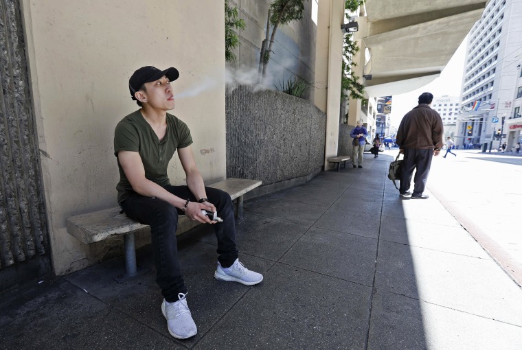 Jacky Chan takes a vaping break from his job at a smoke shop in San Francisco on June 17, 2019.