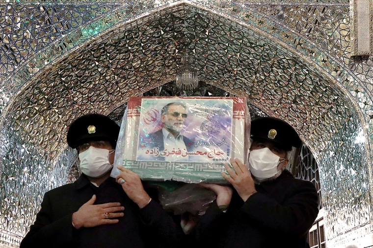 Image: Servants of the holy shrine of Imam Reza carry the coffin of Iranian nuclear scientist Mohsen Fakhrizadeh, in Mashhad