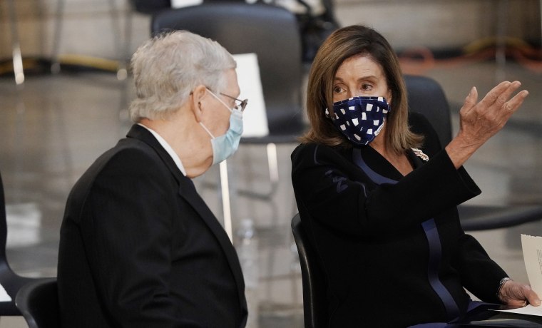 Image: House Speaker Nancy Pelosi (D-CA) (R) and Senate Majority Leader Mitch McConnell (R-KY) (L) talk in the Capitol Rotunda.