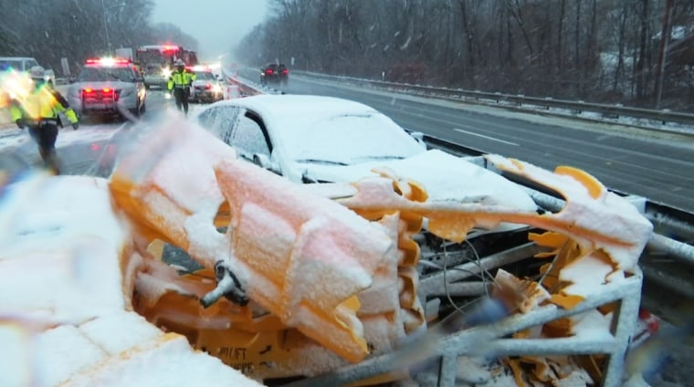 A car crashed into a guardrail during a severe storm in Lincoln, R.I., on Dec. 5, 2020.