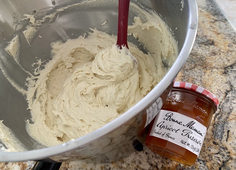 The cake's thick batter, ready to be spread with jam.