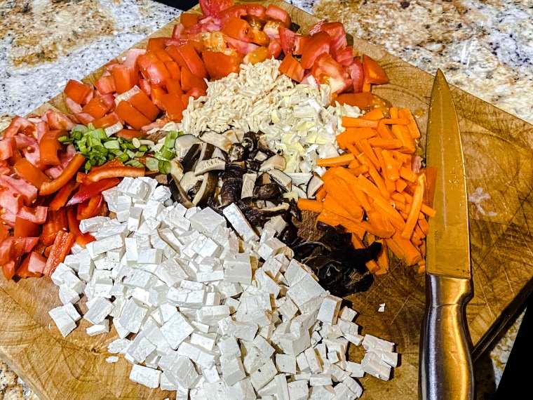 Most of the ingredients in the popular soup get chopped into thin slices.