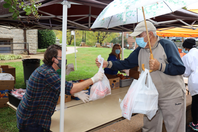 A volunteer hands out meals at Trinity Lutheran church in Greenville, South Carolina.